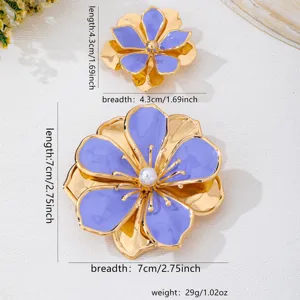 Gold metal purple enamel flower brooch pin set, elegant fashion floral jewelry accessory.