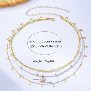 Detailed view of multi-layered waist chain with white beads, gold chains and starfish charm.
