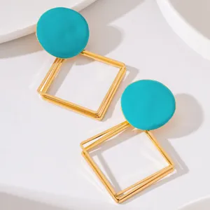 Chic boucles d'oreilles rondes turquoise et losange évidé géométrique multicouche.