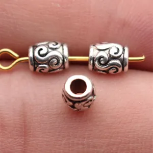 Perles intercalaires argentées à motif de volutes pour tresses de cheveux et bijoux