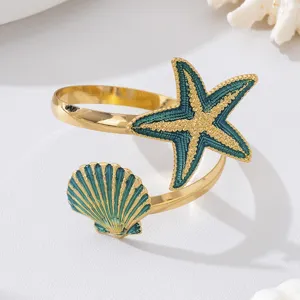 Zomer oceaan stijl metalen open manchetarmband met blauwe druppel zeester en schelp hanger.