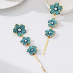 Elegant long floral drop earrings featuring teal enamel flowers and pearl accents for women.