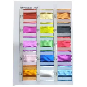 Detailed color sample card showing various metallic matte organza ribbon shades for wedding decor.