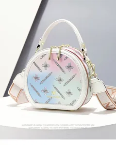 Sweet gradient printed round handbag with top handle and stylish crossbody strap for women.