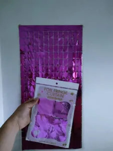 Detail view of square foil fringe curtain, ideal for birthday party and wedding decor.