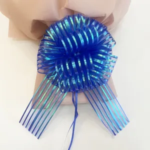 Blue organza pull flower ribbon for Christmas gift wrapping and holiday decoration, stunning detail view.