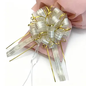 Detailed close-up of large Christmas wedding car decorative pull bow with tree pattern.
