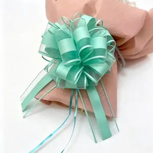 Detailed view of large mint green gift ribbon bow, perfect for festival and Christmas packaging.