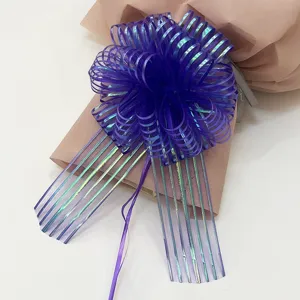 Purple organza pull bow ribbon detail, perfect for gift wrapping and holiday party decoration.