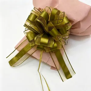 Extra large olive green ribbon pull bow for holiday Christmas gift wrapping and decoration detail.