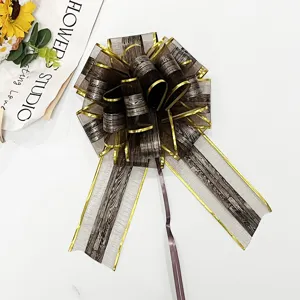 Large wooden grain snow gauze pull bow ribbon for Christmas holiday gift wrapping decoration.