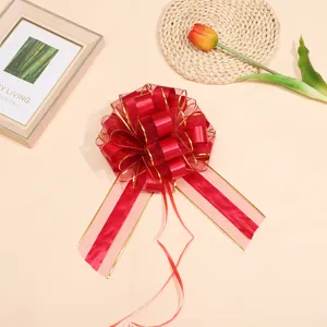 Large red mesh pull bow with gold edges, perfect for gift wrapping and wedding car decor.