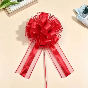 Red mesh pull bow for Christmas gift wrapping, decorative large ribbon flower package.