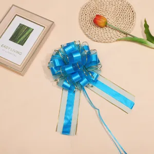 Large blue gold-edged ribbon pull bow for gift wrapping, Christmas and wedding car decoration.