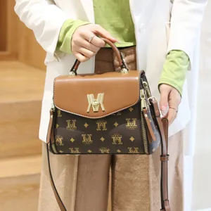 Fashion Korean style women's monogram shoulder bag, elegant brown crossbody handbag with top handle.