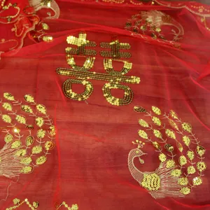 Red bridal veil with gold sequins and peacock embroidery for traditional Chinese wedding.