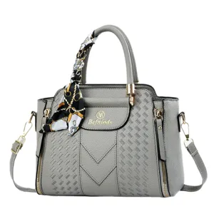 Grey embossed handbag with stylish scarf decor, versatile shoulder crossbody bag for daily work.