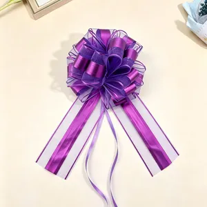 Purple gift pull bow for Christmas present wrapping, large matte ribbon decorative flower.