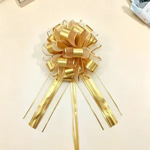 Gold metallic pull bow for Christmas gift wrapping, large 6.4cm decorative 3D ribbon.