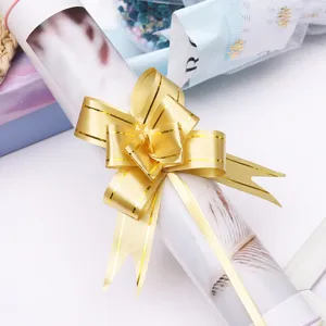 Gold pull bow ribbon for gift wrapping, flower bouquet decoration and festive party supplies.