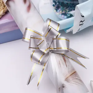Silver ribbon pull bow with gold trim for gift wrapping, flower bouquet and holiday decoration.