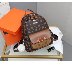 Brown monogram leather backpack for women, stylish casual travel daypack with cute pom-pom.