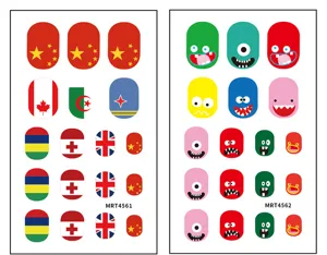 Detailed view of colorful cartoon monster and national flag nail stickers sheets for DIY nail art design.