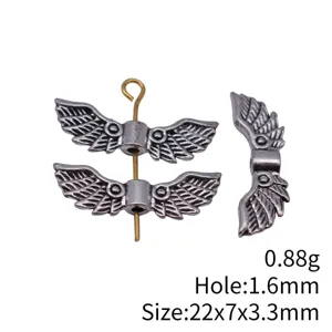 Silver wing metal bead detail shot, 22x7x3.3mm hole 1.6mm jewelry accessory crafting part.