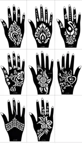 Hand henna tattoo stencil detail view showing intricate floral and geometric hollow patterns.