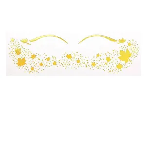 Gold foil temporary face tattoo sheet with maple leaves and eyeliner design for party makeup.