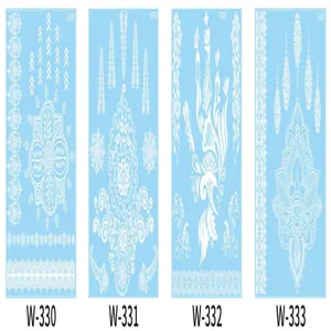 Detailed view of white lace temporary tattoo sheets featuring intricate henna body art designs.