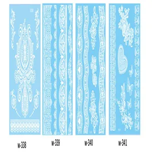 White lace tattoo sticker detail shot, showing intricate floral patterns and lace designs.