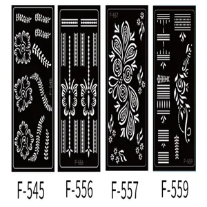 Detailed view of PET hollow tattoo templates with intricate floral and geometric henna patterns.