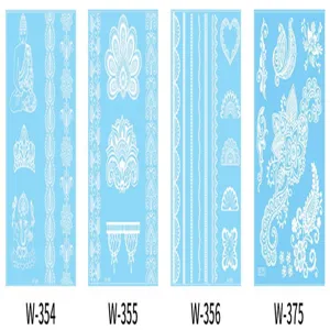Detailed view of white lace henna tattoo stickers featuring intricate geometric and floral designs.