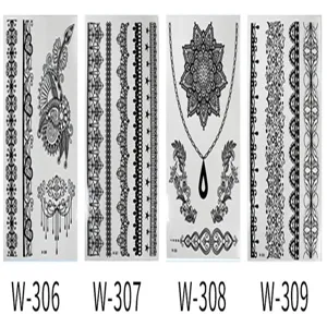 Close-up detail shot of intricate black lace tattoo sticker sheets with floral geometric motifs.