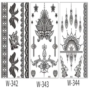 Detailed view of black lace temporary tattoo stickers, bridal body art wedding design sheets.