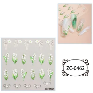 Detailed view of 5D embossed lily of the valley and bow nail stickers sheet with nail art display.