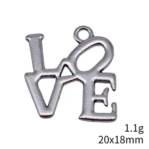 Antique silver LOVE letter pendant detail shot, vintage style metal jewelry accessory.