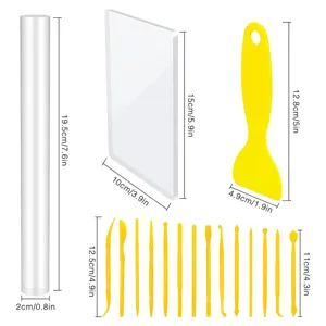Detailed dimensions of 23-piece pottery tool set including roller, acrylic sheet, and scrapers.