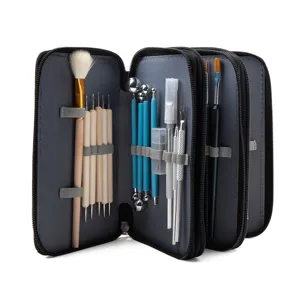 Detailed close-up view of open multi-layer fabric storage case with clay pottery tools inside.