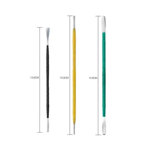 Pottery sculpting tools detail, dual-ended metal clay carving sticks with wrapped handles.