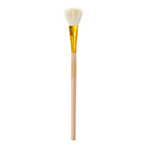 Close up detail view of pottery paint brush featuring wooden handle and soft bristles