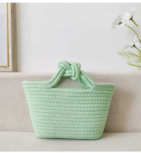 Charmante Mini-Baumwollseil-Handtasche mit elegantem Knotengriff für den perfekten Look.