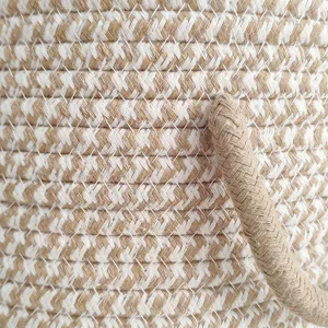 Woven cotton rope storage basket with handles, round hamper for home organization and toys.