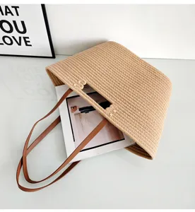 Casual minimalist woven tote bag with brown leather handles, large capacity for beach vacation.