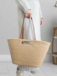 Casual minimalist woven tote bag with leather handles, large capacity shoulder bag for beach vacation.