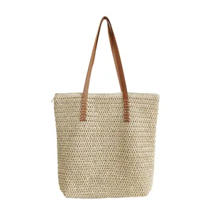 Gewebte Stroh-Shopper Tasche für Damen, große Strand-Schultertasche in Beige mit braunem Griff.