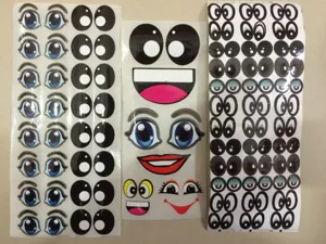 Cartoon doll eye stickers detail shot showcasing diverse fun expressions and styles for DIY crafts.