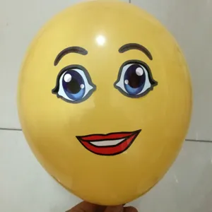 Yellow round latex balloon featuring a cute cartoon face with big blue eyes and red lips for party.