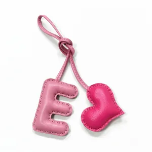 Pink leather letter E and heart bag charm, handmade stitched keychain and purse accessory.